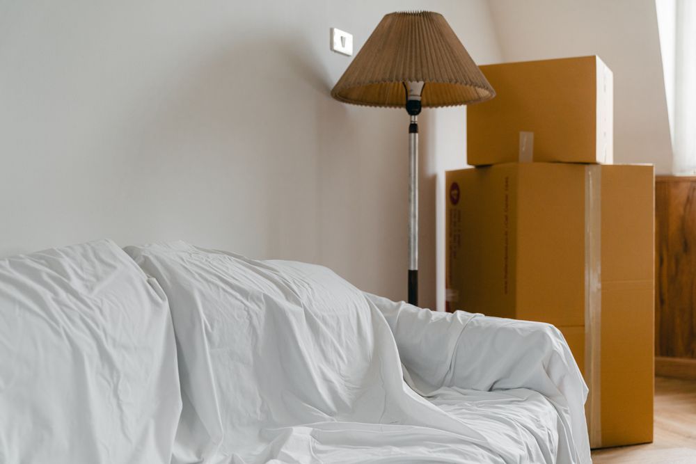 Boxes and furniture waiting to be unpacked in a new house