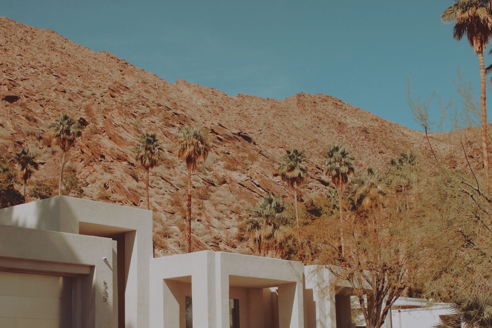 A modern villa with a desert mountain backdrop