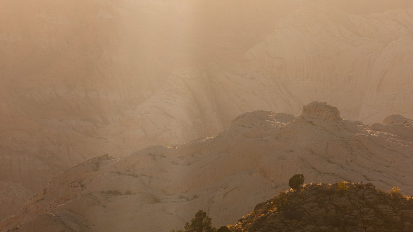 Layered sandstone ridges at sunrise in Southern Utah
